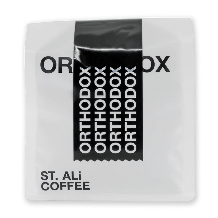 A white 250 gram bag of coffee with black & white text.