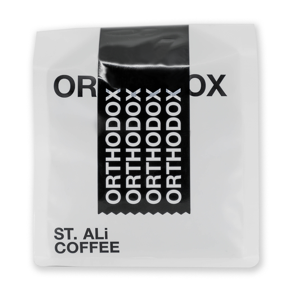 A white 250 gram bag of coffee with black & white text.