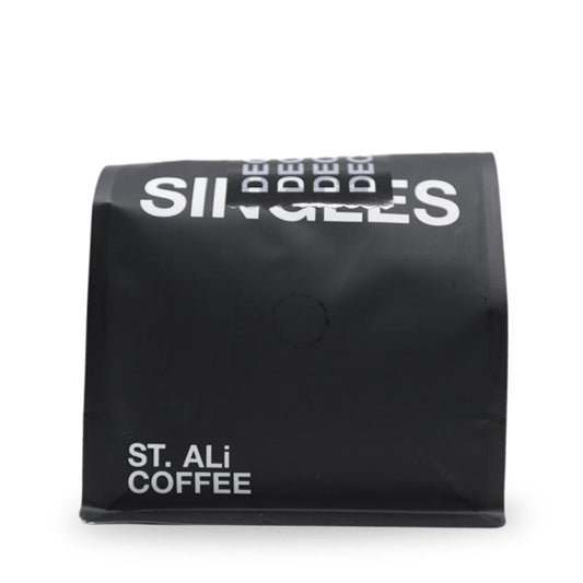 A front on image of a 250 gram coffee bag.  Decaf blend in a black coffee bag.